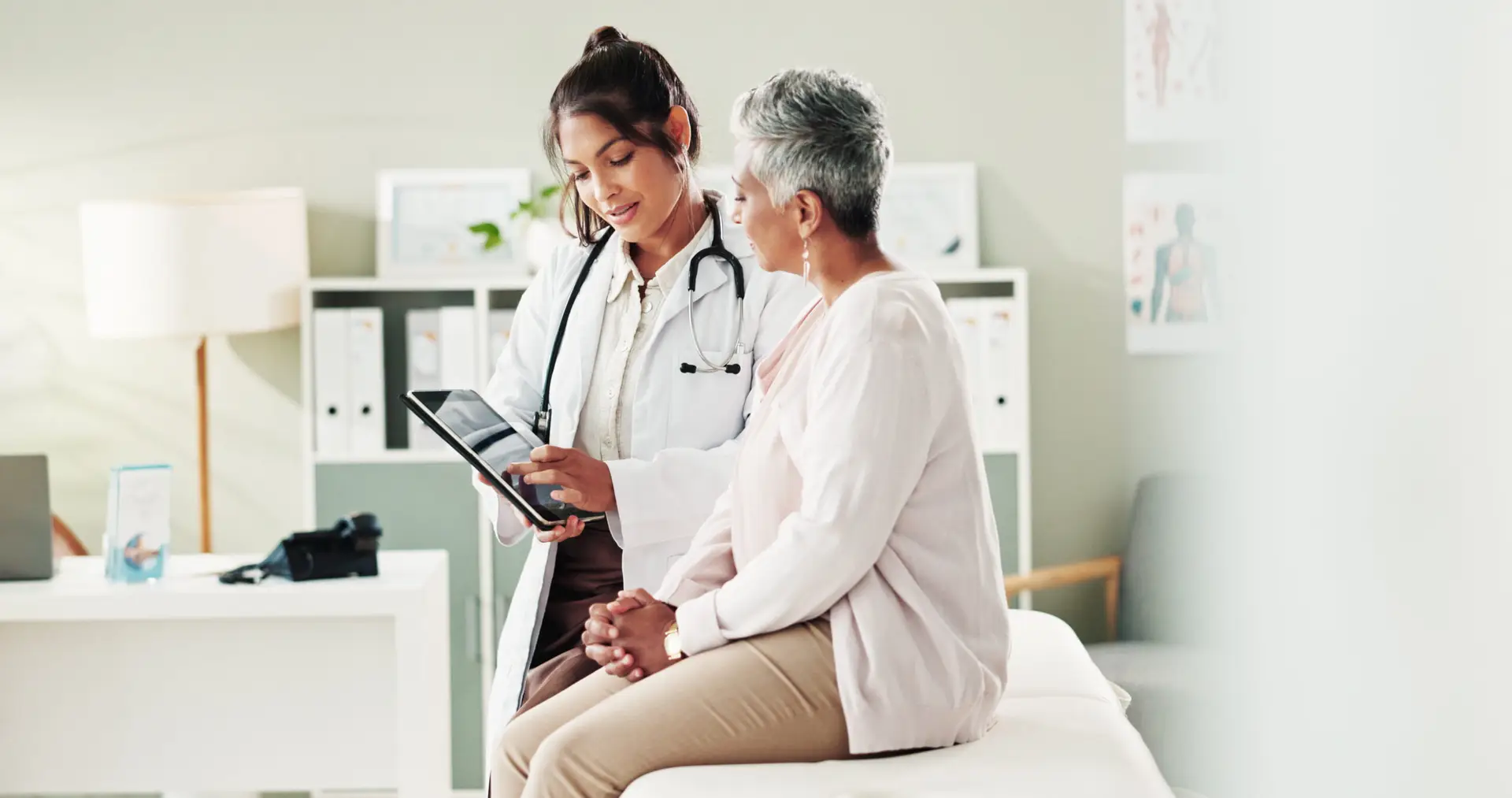 A doctor reviewing information with an older patient