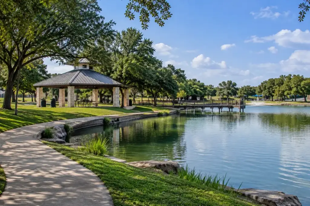 Main City Park in Live Oak, Texas with pond, pavilion, walking path, and fountain