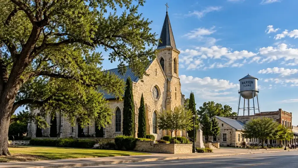 Historic stone church and Marion, Texas water tower in a small-town streetscape